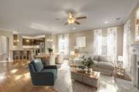 View of the living room looking back toward the kitchen and entry foyer. In this VIRTUALLY STAGED image, you see just some of the options for decorating the expansive space.
