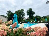 With umbrellas and lounge chairs for HOA member use, the pool is another great benefit of The Patterson Farms Community.