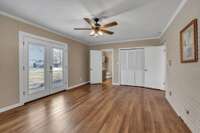 Primary bedroom has a ductless unit and access to the screened porch.