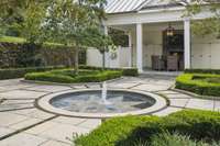 Formal garden and outdoor kitchen/BBQ with fireplace