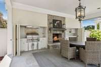 BBQ, fridge, and warming drawer hidden behind doors.