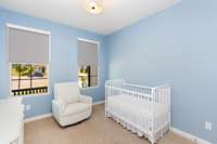 The floor plan has been thoughtfully designed with a second bedroom on the main level.  Fabric roller blinds provide privacy and the flexibility of light control.