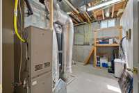 Down stairs utility room. The literal hub of the house. The HVAC is serviced by Hiler Plumbing & Air. There is a tankless water heater.