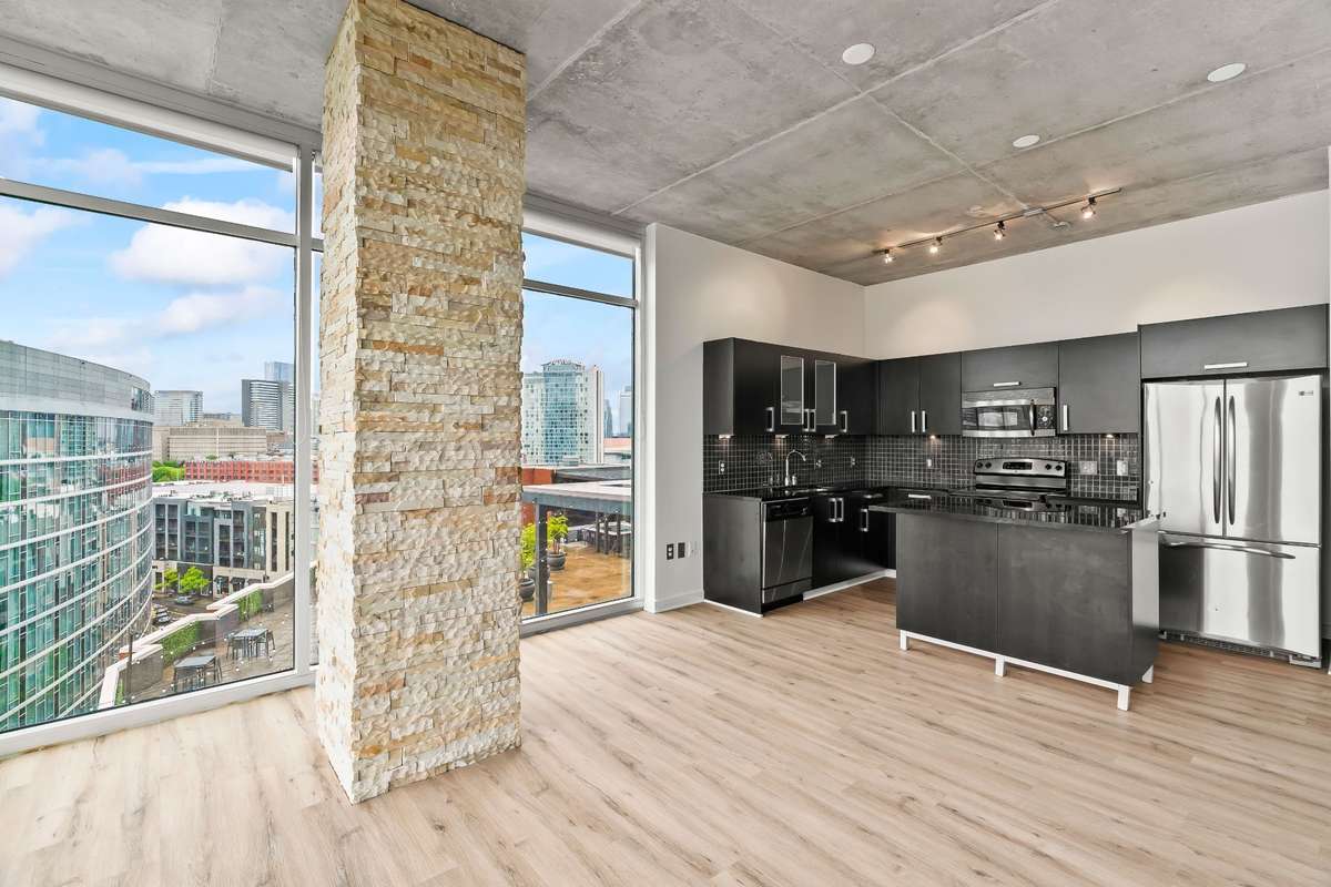 Kitchen island pictured is movable and conveys with property.