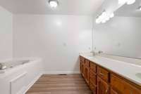 Enjoy soaking in the garden tub in the primary bathroom.