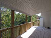 Back deck sunset views over tree tops.