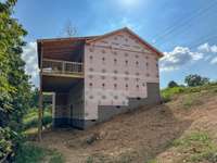 That space below! I suggest a SOLID concrete patio. Just my thoughts.