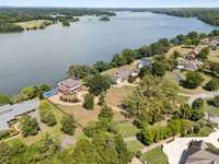 50 ft above the lake ( NOT in a flood zone),3 sides of the property are fenced. 1.25 acres mostly in the front yard.