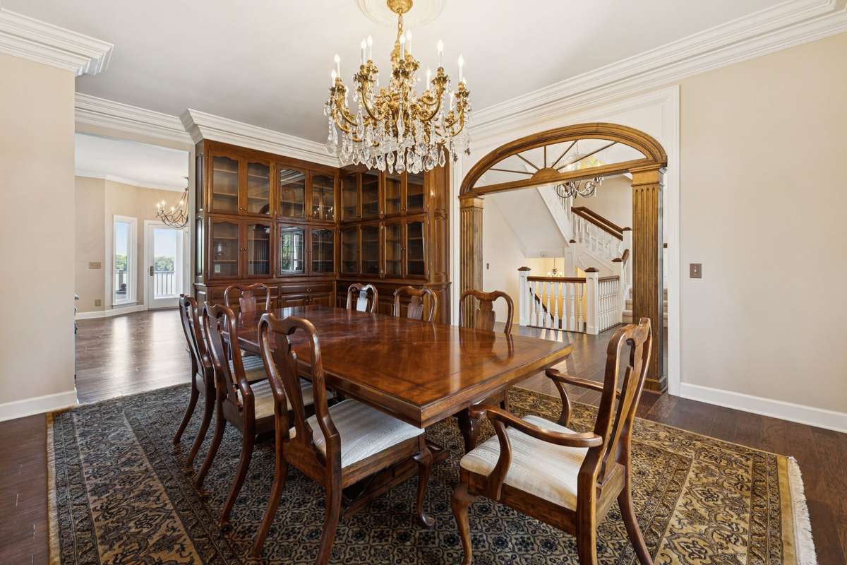 Two walls of floor to ceiling built in china cabinetry. 10 ft ceilings and oversized mouldings throughout.