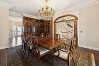 Two walls of floor to ceiling built in china cabinetry. 10 ft ceilings and oversized mouldings throughout.