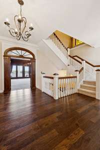 Feels like a historic masterpiece, but was built in 1984.gorgeous wood floors, mahogany banister on this three story stairwell. Elevator access to all levels.