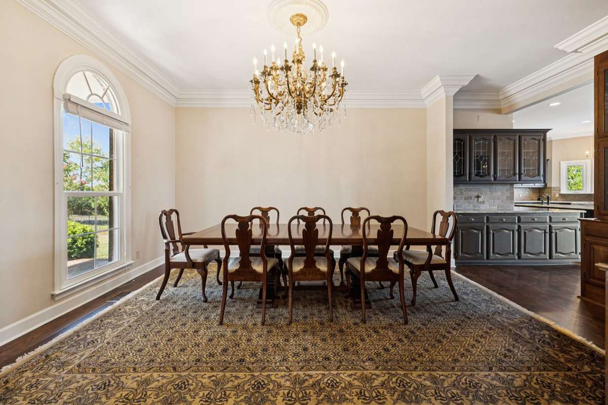 Formal dining boasts a stunning 150 year old chandelier.