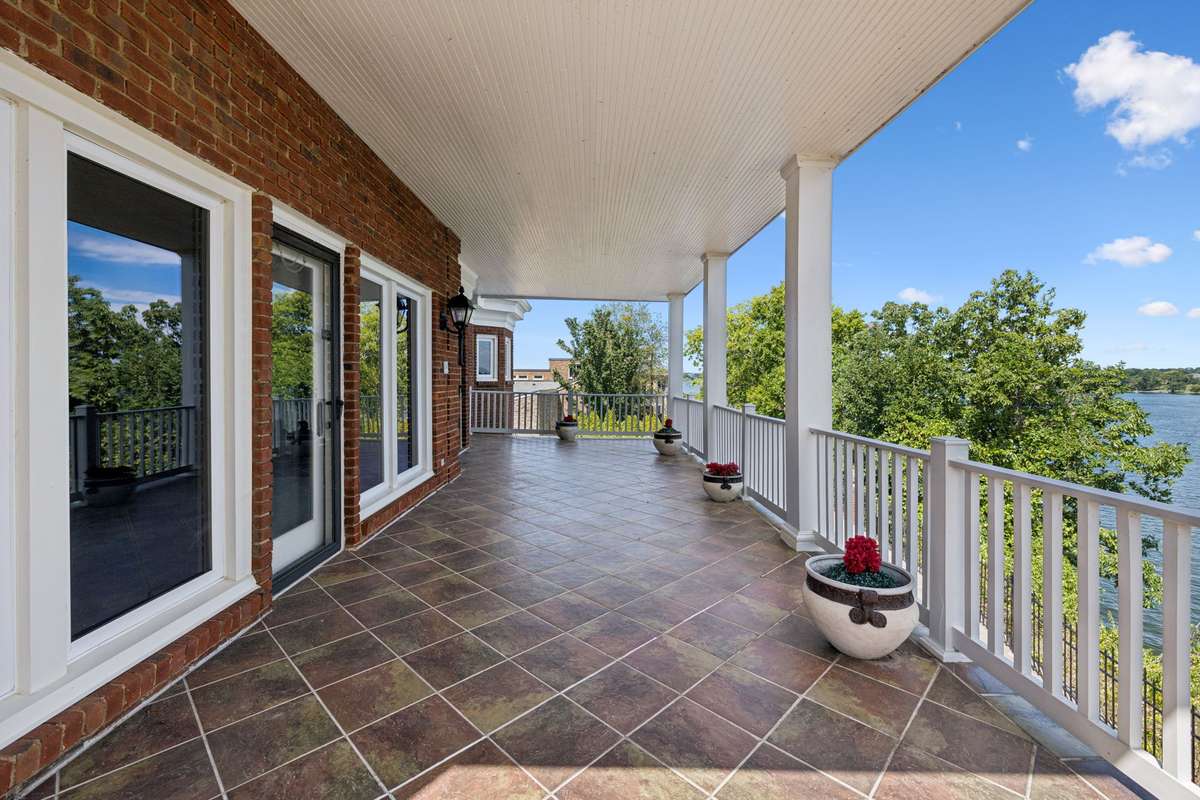 Step outside from the living room and relax on this balcony offering amazing views and plenty of privacy.
