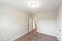 Both guest rooms are right off the bonus/flex room.