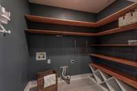 The combined laundry and pantry closet keeps essentials organized and within easy reach.