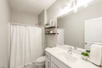 The guest bath is conveniently located next to the guest bedroom.
