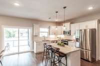 Crisp white cabinets and a light-filled design make this kitchen the heart of the home.