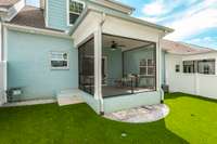 With its combination of turf, fencing, and functional features, this space is ready for both play and relaxation.