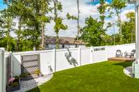 The fenced backyard with a gated entry offers both privacy and security for relaxing or entertaining.
