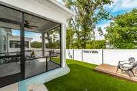 This inviting outdoor retreat is ideal for dining al fresco, entertaining friends, or simply unwinding in a private, shaded setting.