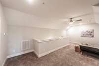 There’s also ample space to create two separate desk or office areas, making it ideal for remote work or study. If you need a playroom or a place to keep toys organized, this room easily adapts to that as well.