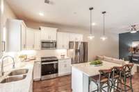 The spacious island is ideal for meal prep, serving snacks, or adding extra seating when entertaining.