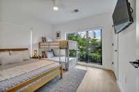 Bedroom 2 also has a queen bed and twin bunk bed, so an additional 4 guests can comfortably sleep here. This bedroom also has a 40" wall-mounted Roku TV.