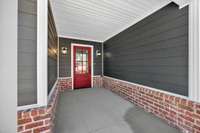 The covered front porch allows shelter from the elements for visiting guests!