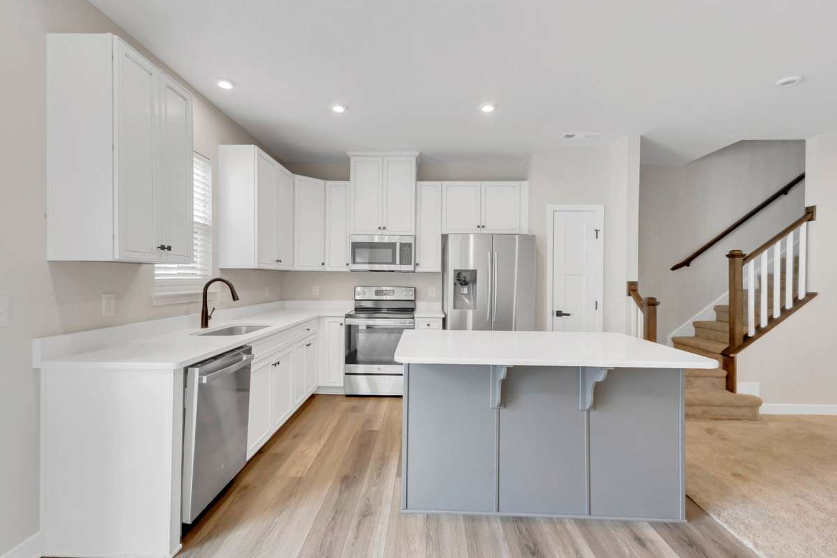 The two tone cabinetry is so stylish