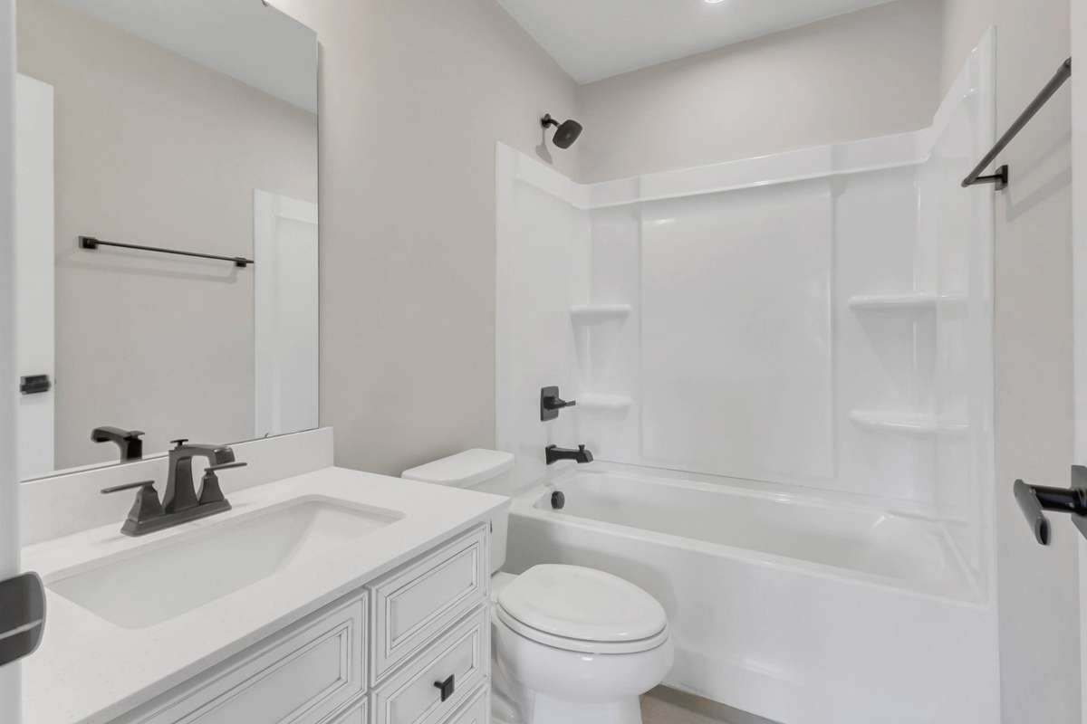 Hall bath serves secondary bedrooms