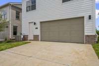 2-Car Garage with Driveway and Back Door Entry.