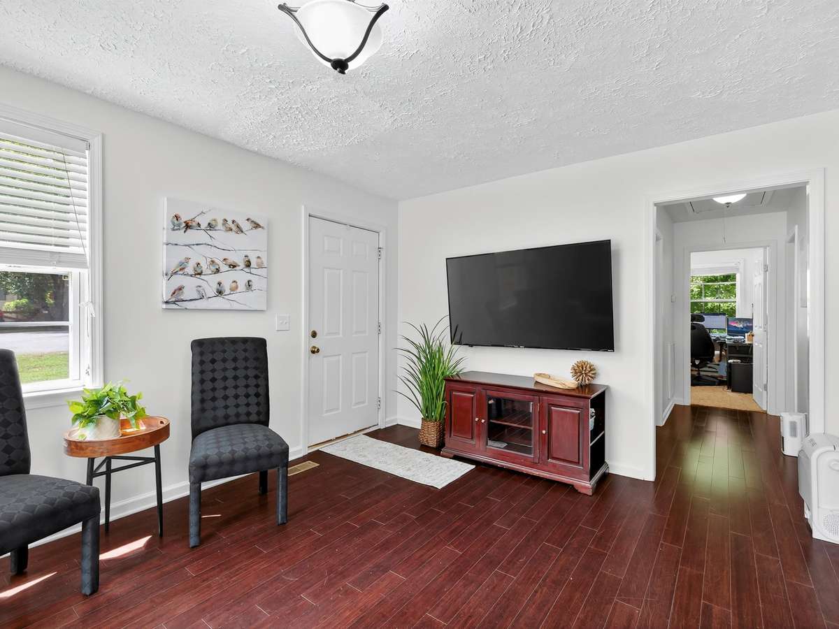 Living room with hall leading to bedrooms.