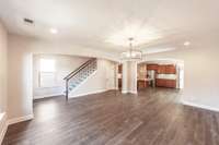 Great room.  Pretty hardwood flooring. Hardwoods on the stair treads.