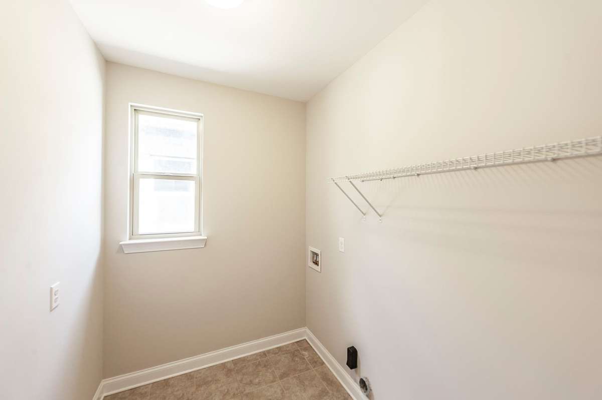 Laundry Room on the second floor.  Love the window.  Helps to see those spots on your clothes.