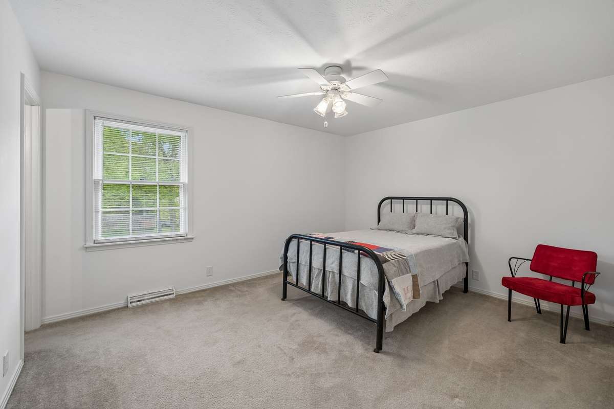 The primary suite offers a spacious layout with a double closet and an en-suite bathroom for added privacy.