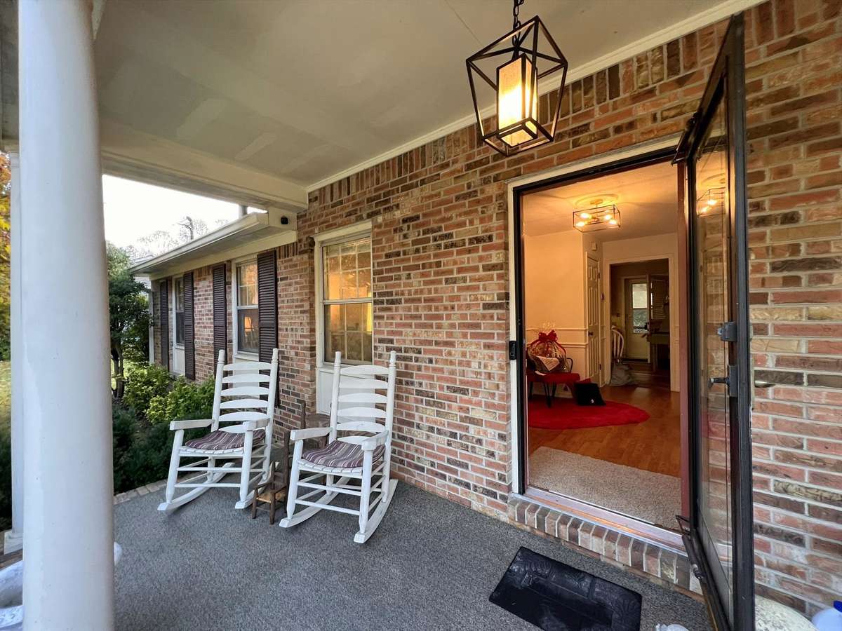 The wide covered front porch is the perfect place to sip a glass of lemonade on warm summer days.