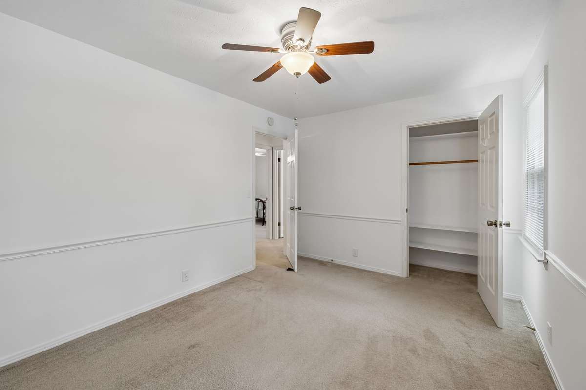 This comfortable bedroom also features an oversized closet with extra shelving