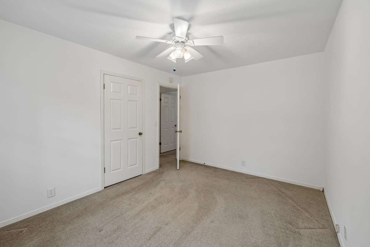 Plush carpeting and another oversized closet make the room both comfortable and functional.