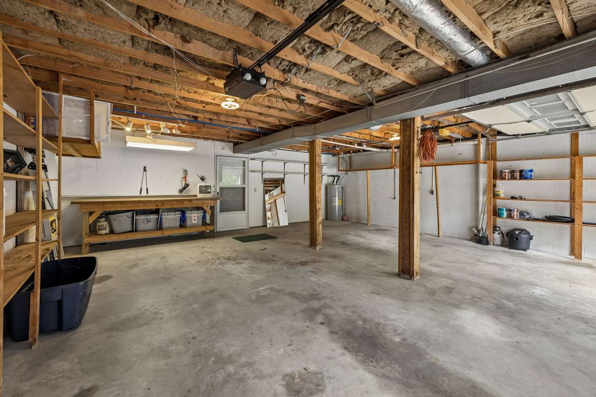 This versatile utility area provides ample room for hobbyists and home projects alike.