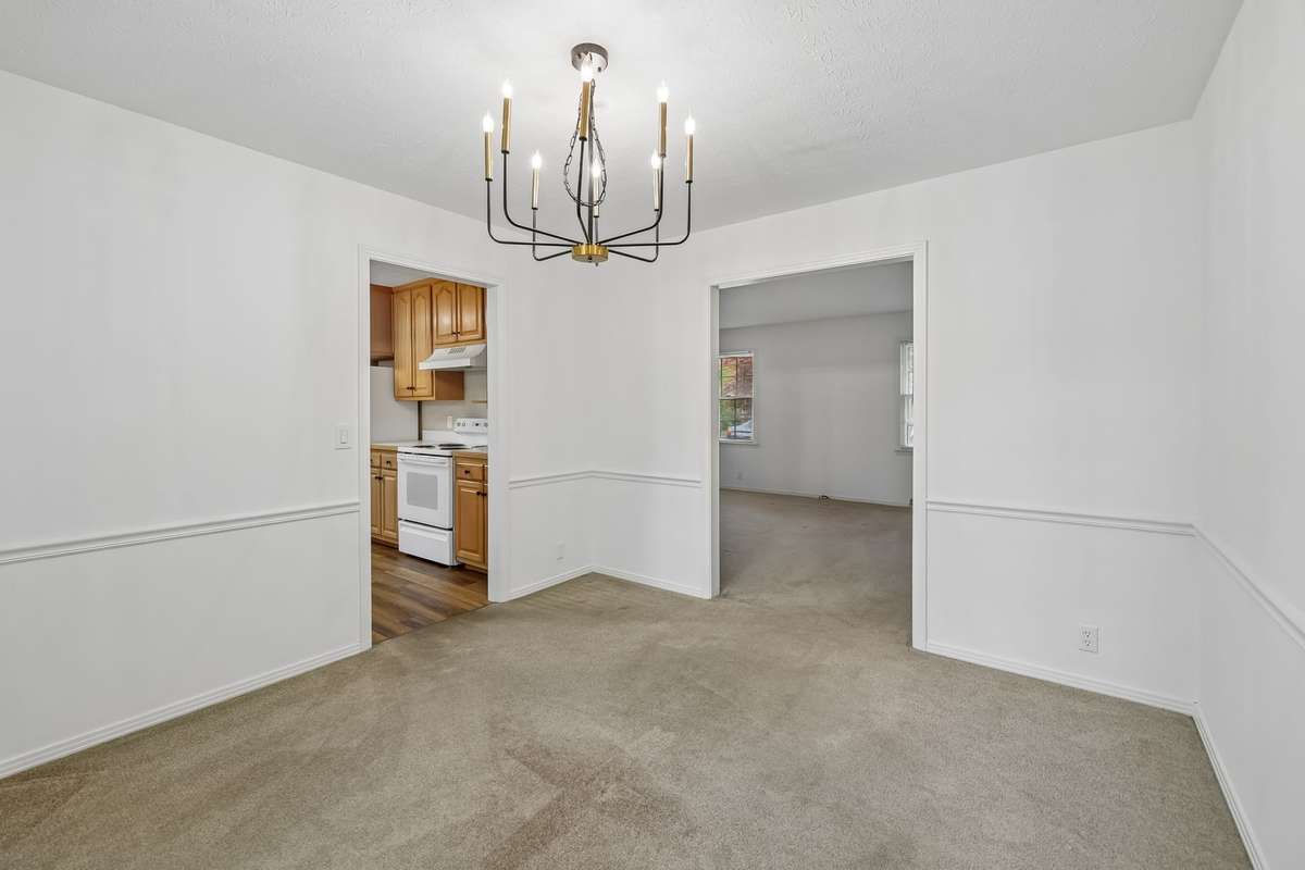 Positioned just off the kitchen, the dining room is perfectly situated for serving formal holiday meals or hosting dinner parties in style.