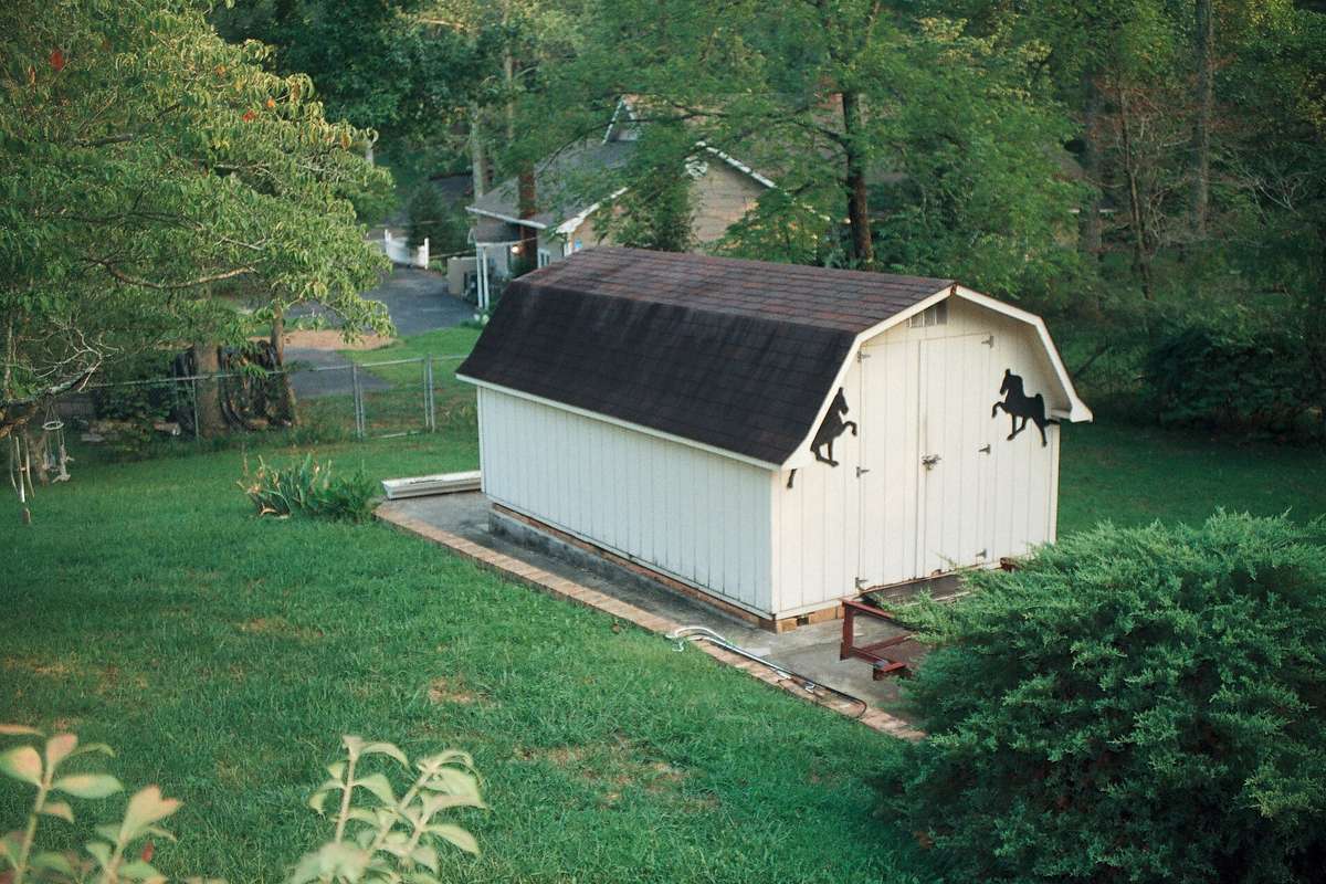 A large outdoor shed provides extra storage for all your tools and toys.