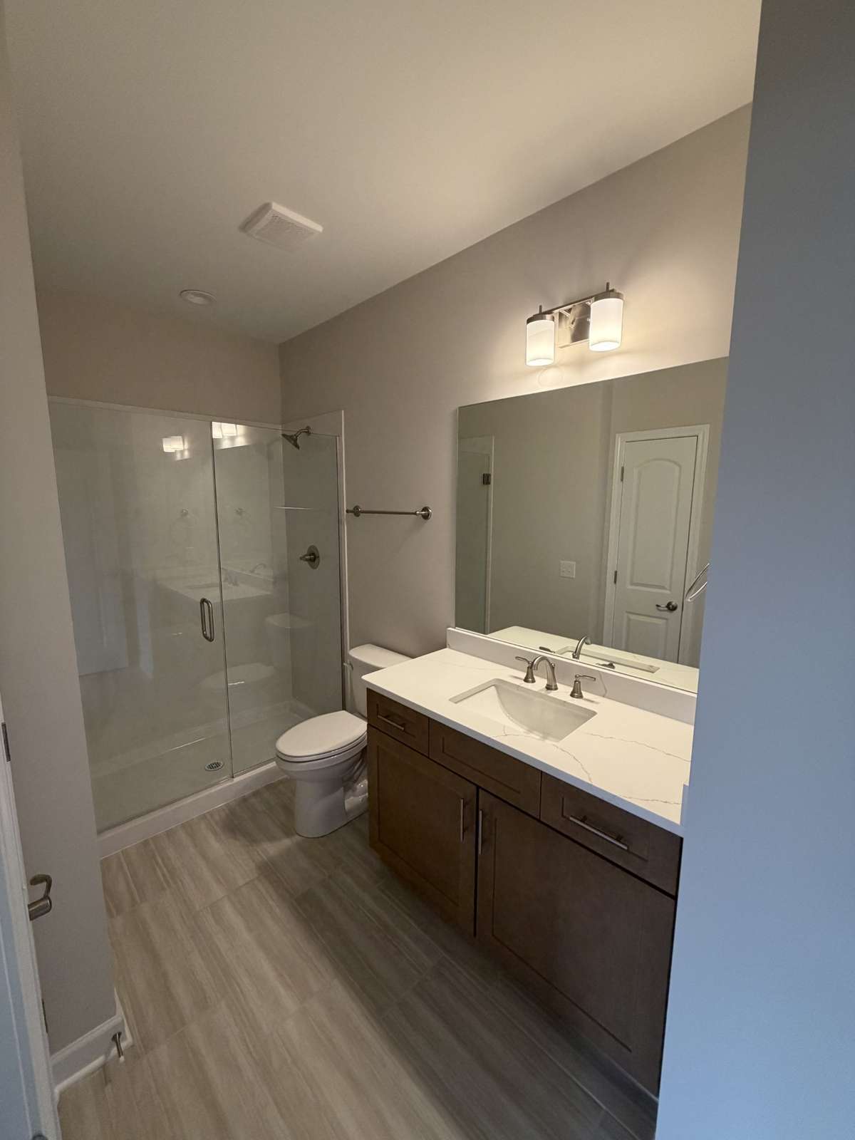 Full guest bath with walk-in shower on main level