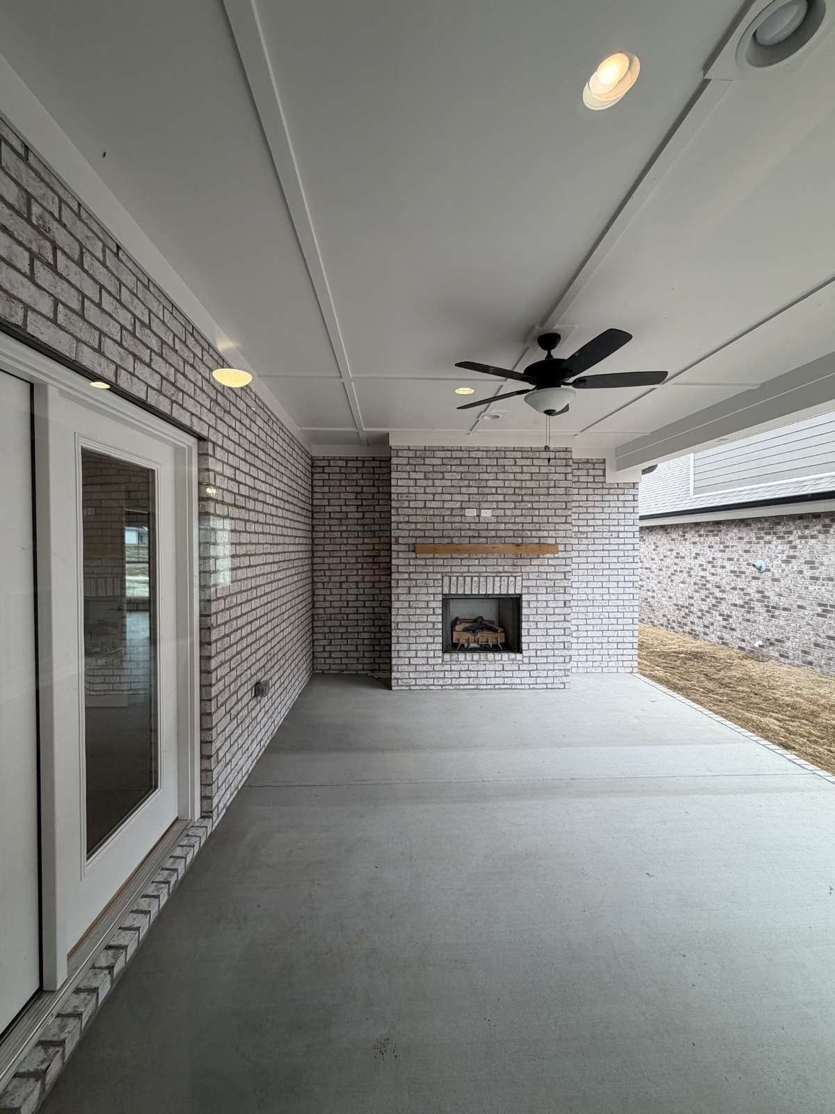 Extra large side patio with a gas fireplace and a gas hookup for your outdoor kitchen