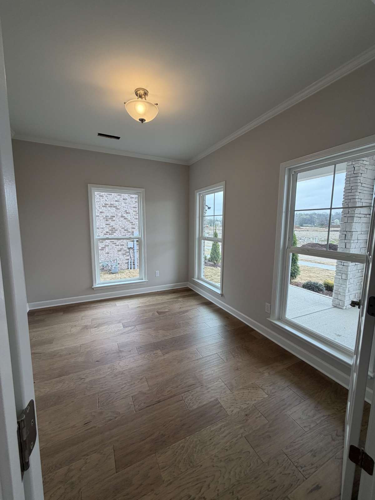Front office with double glass french doors and lots of windows allowing for natural light