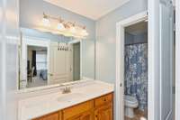 Full bath across from bedroom