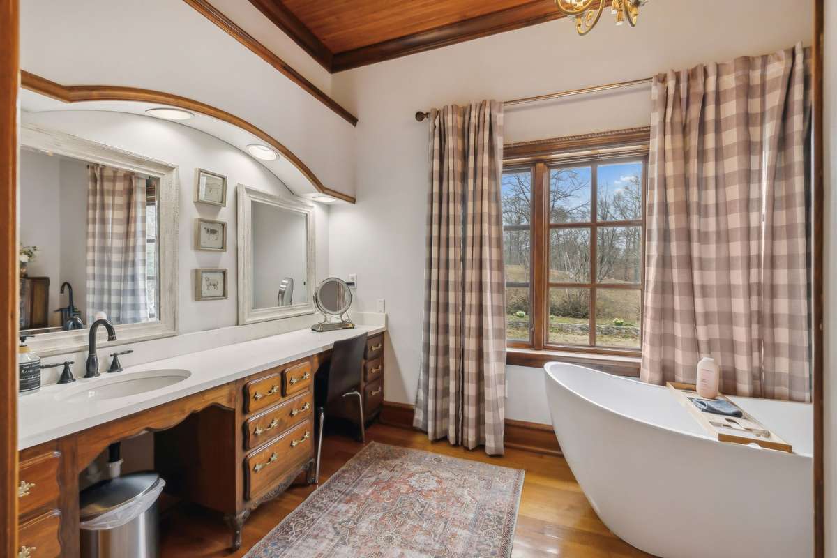 Primary Suite Vanity space with a nice tub and makeup areari
