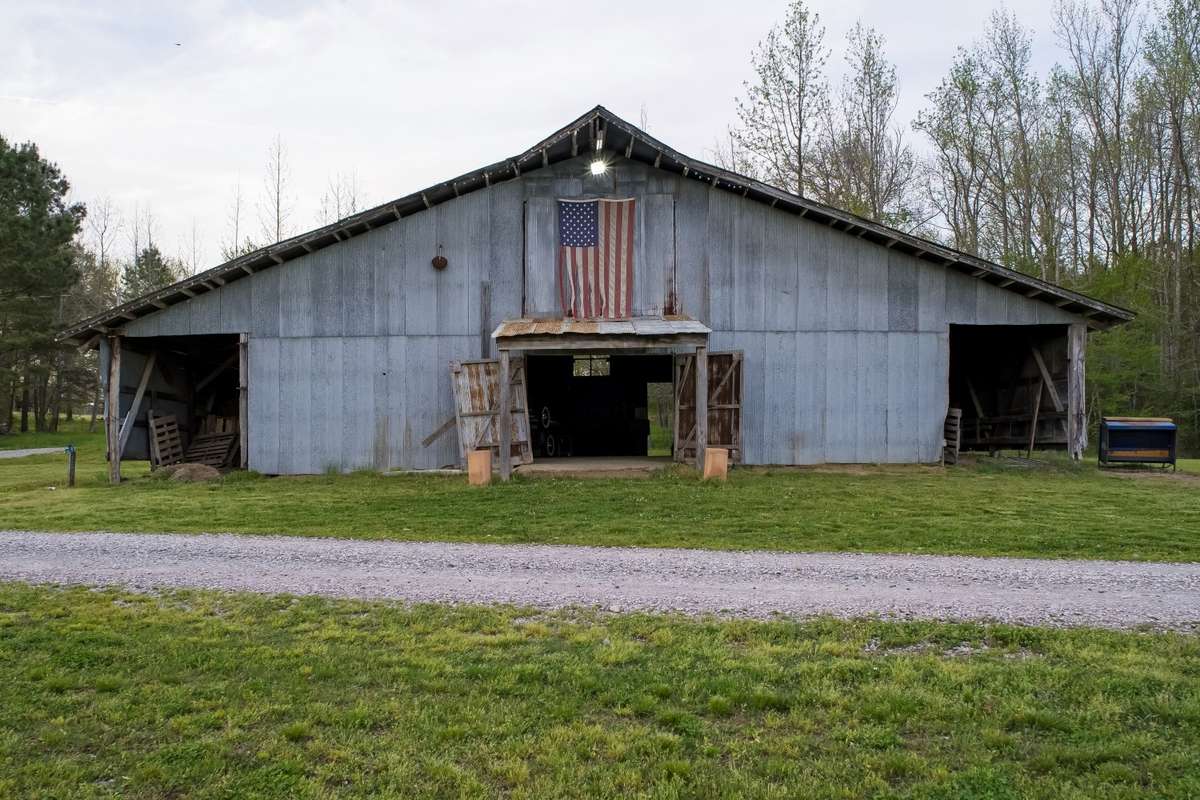 Hay Barn located just as you are coming up the 1/2 mile long paved driveway to the main house.