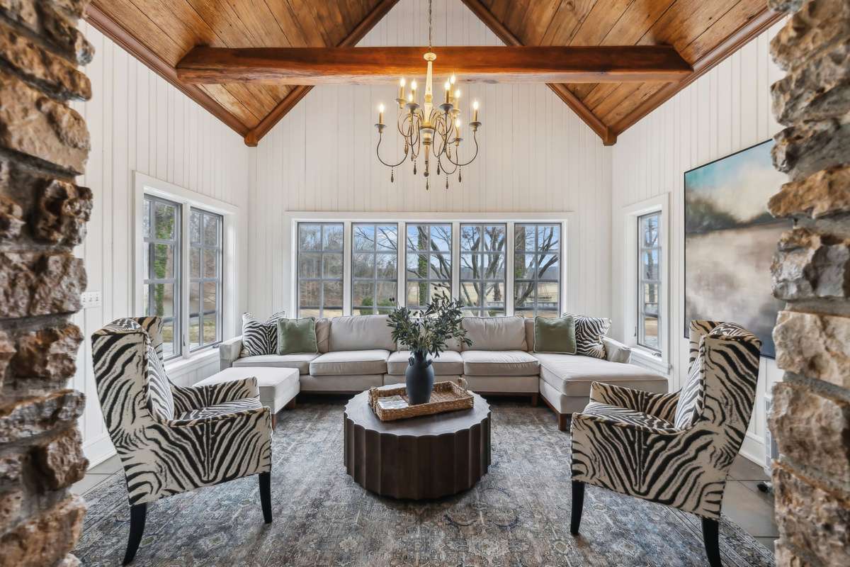 Beautiful Sun room just off the kitchen that leads out to the outdoor pavillion