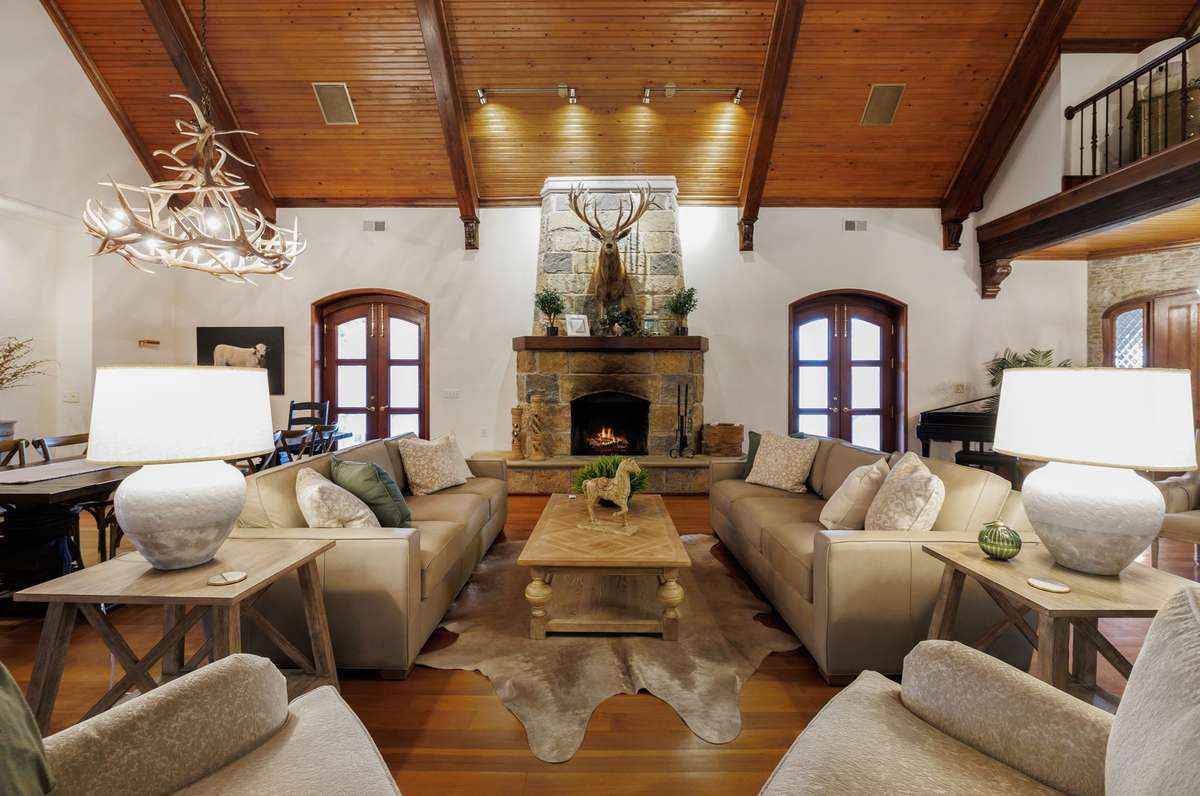 Famiily room main level with a gas fireplace. Notice the gorgeous wood throughout the finishes and was all from the property