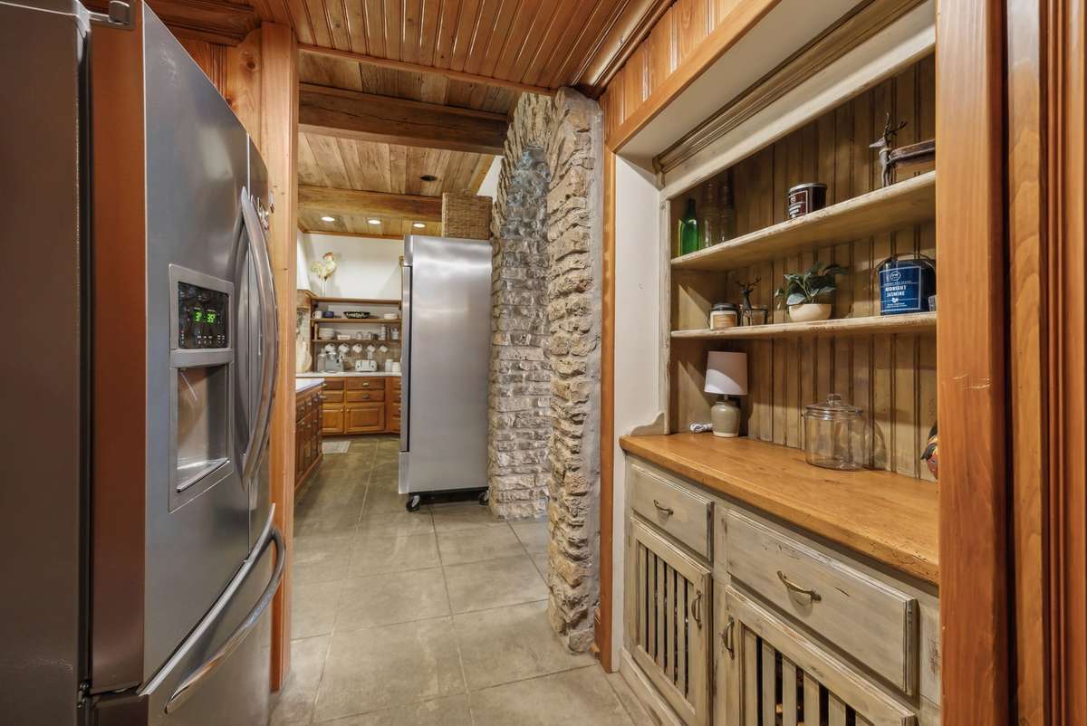 Bar area between the kitchen and leading to the Laundry room and climate controlled garage